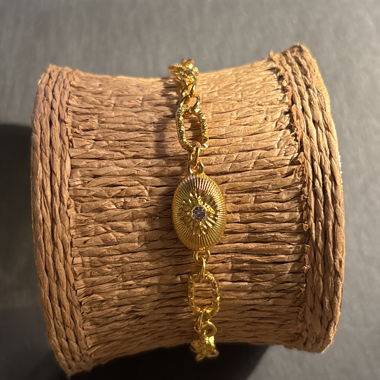 Gold-colored bracelet with stone
