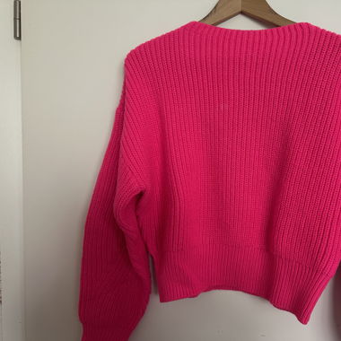 Pull tricoté rose fluo