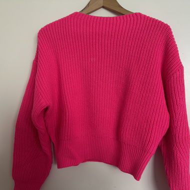 Pull tricoté rose fluo