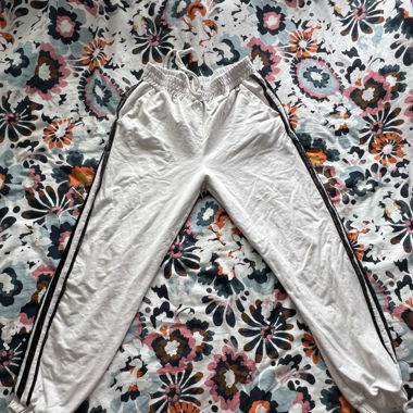 White sweatpants with black lace