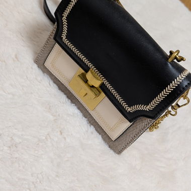 Borsetta elegante nero/beige con dettagli dorati