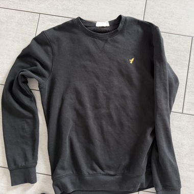 Felpa nera con logo giallo