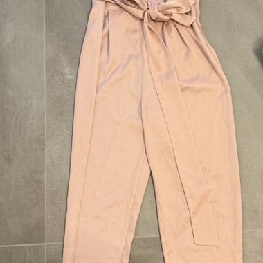 Pink jumpsuit with tie belt