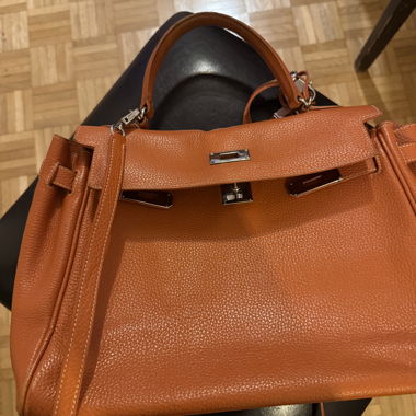 Large orange grained leather handbag