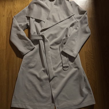 Beige trench coat with tie belt