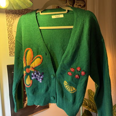 Cardigan in maglia verde con motivi 