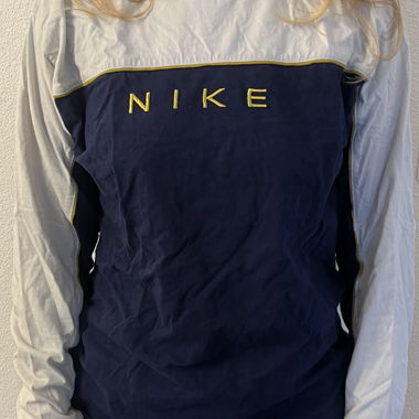 Haut à manches longues Nike bleu/blanc avec lettrage jaune