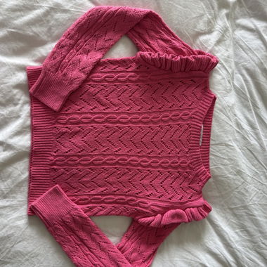 Rosafarbener Strickpullover