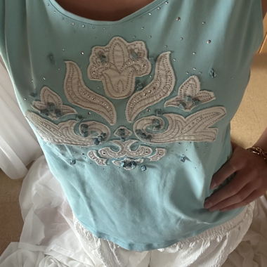 Top senza maniche decorato turchese