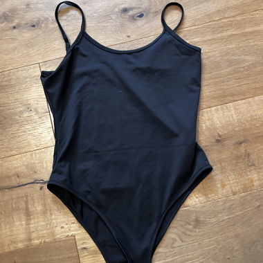 Black bodysuit with spaghetti straps