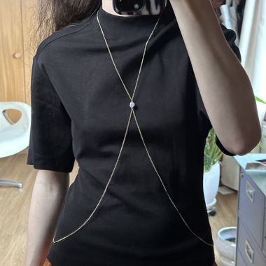 Gold body chain with pink central stone
