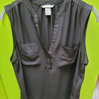 Blouse sans manches noire avec poches