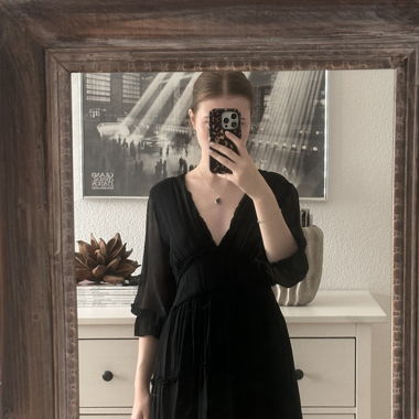 Lightweight black summer dress with a V-neckline