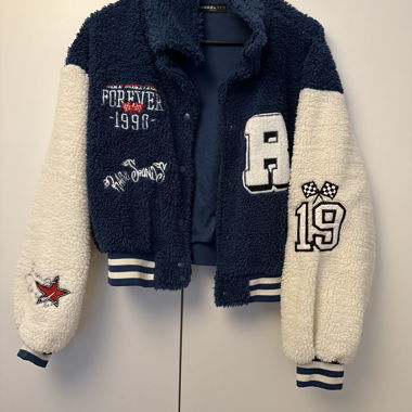 Blue and white teddy embroidered varsity jacket