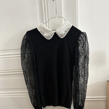 Pull à manche transparente 