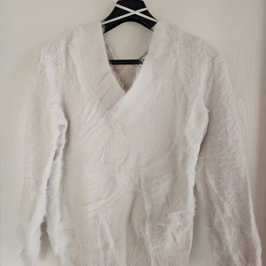 White fuzzy sweater, fitted at the waist