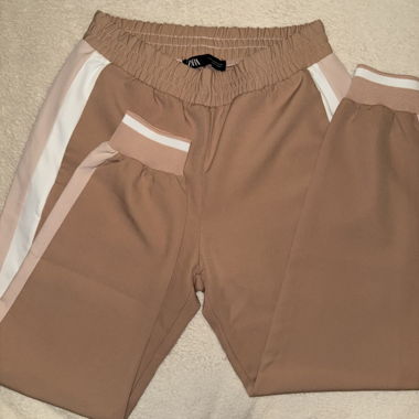 Pink training pants with stripes