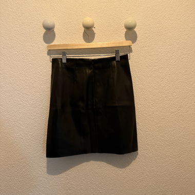 Black faux leather mini skirt
