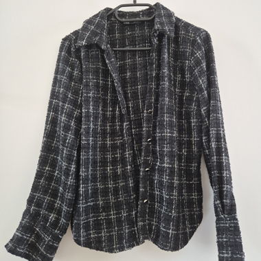 Blusa Zara in tweed nero-bianco