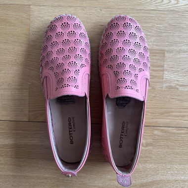 Pink perforated slip-on shoes
