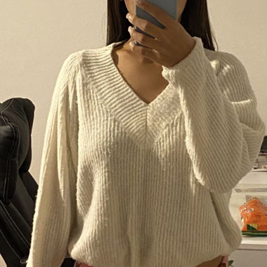 Subdued white sweater