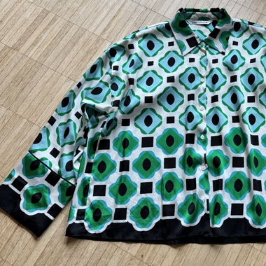 Green and blue patterned blouse