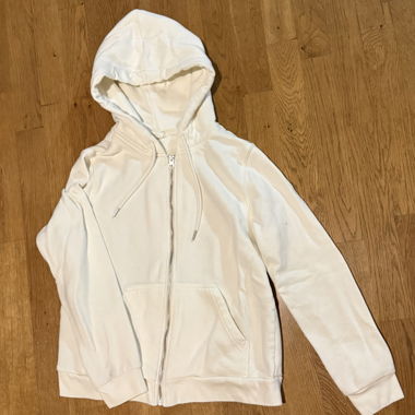 Veste à capuche blanche avec fermeture éclair