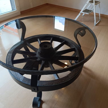 Vintage glass table with original wagon wheel