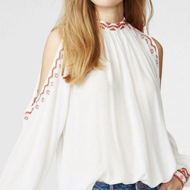 Blusa bianca a maniche lunghe ricamata