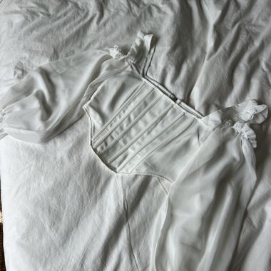 Top corsetto con maniche