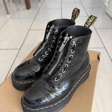Black Dr. Martens lace-up boots