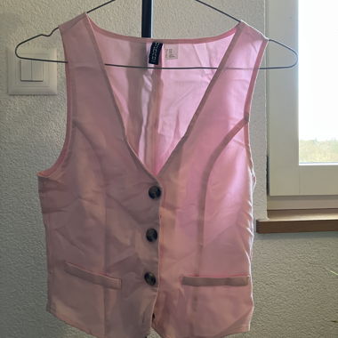 Pink women's vest with buttons