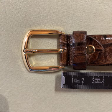 Leather belt with brass buckle