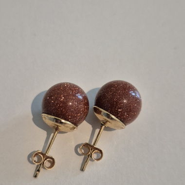 Clou d'oreilles brun brillant