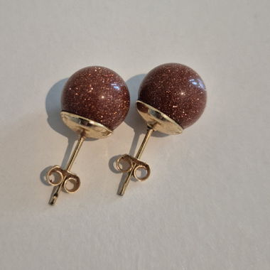 Clou d'oreilles brun brillant