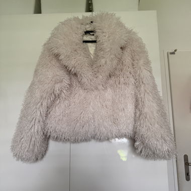 Veste en fausse fourrure beige 