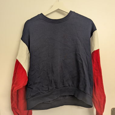 Dark blue sweater with red sleeves