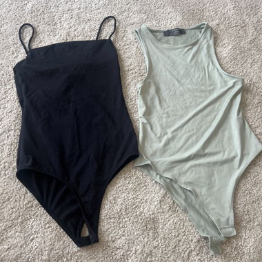 2-pack of black and light green bodysuits 