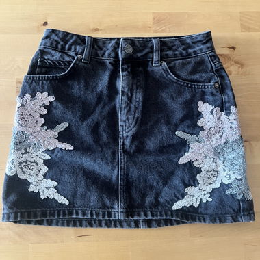 Black denim skirt with patterns