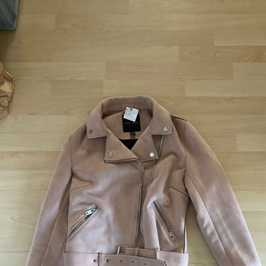 Veste rose poudré