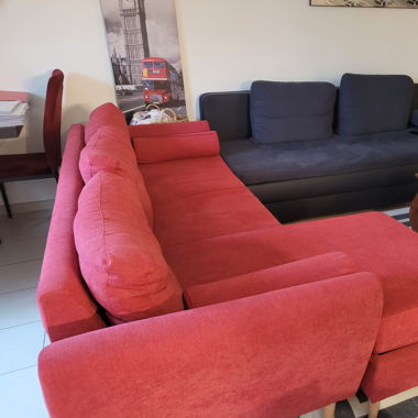 Red Sofa and Wooden Tables