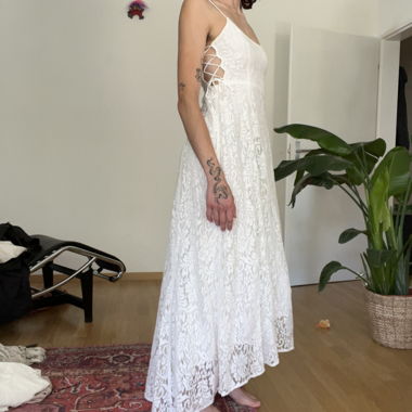 detailed dress with corset-like straps on the side