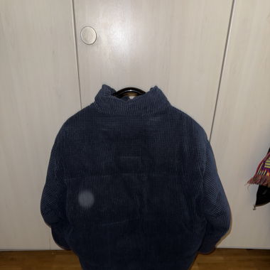 Blaue Cord-Pufferjacke
