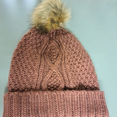 Brown knit beanie with faux fur pompom