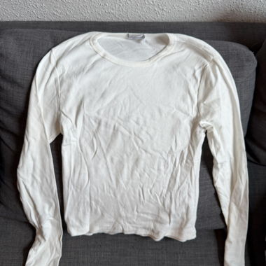 Top bianco a maniche lunghe