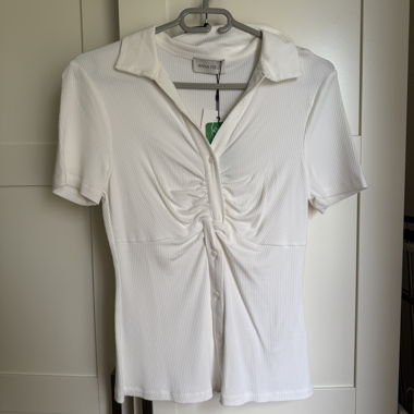 Polo bianco a coste